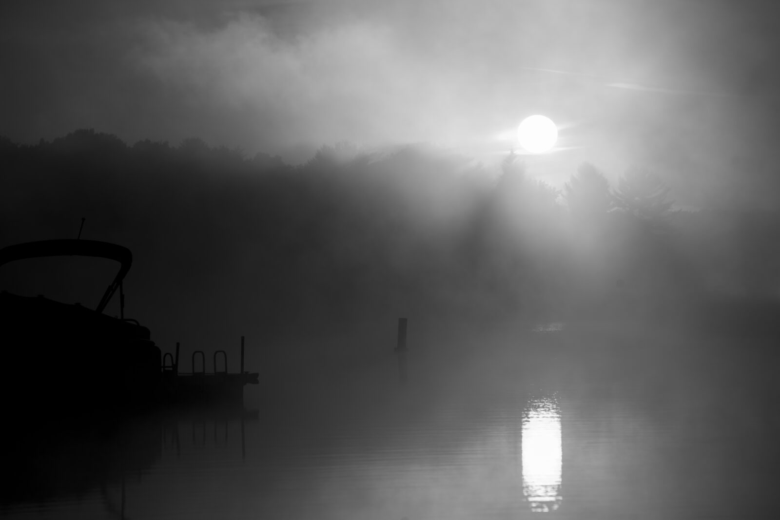 A misty lake at dawn