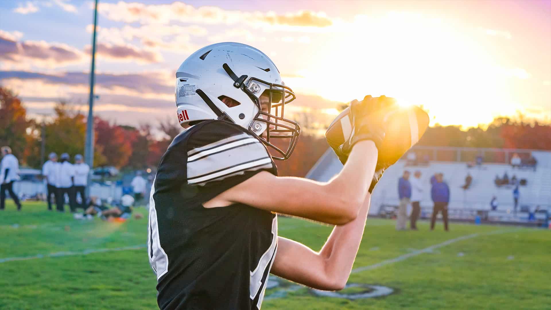 Sentara RMH Medical Center high school football player catching ball